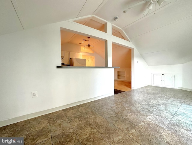 additional living space featuring ceiling fan, vaulted ceiling, and hardwood / wood-style flooring