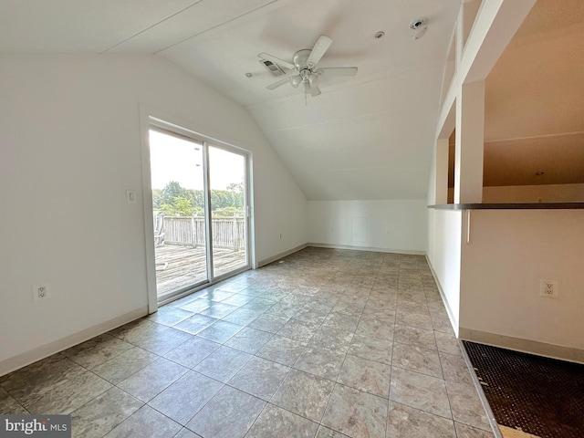 bonus room with ceiling fan, vaulted ceiling, and light tile patterned floors