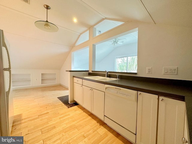 kitchen with ceiling fan, dishwasher, vaulted ceiling, and light wood-type flooring