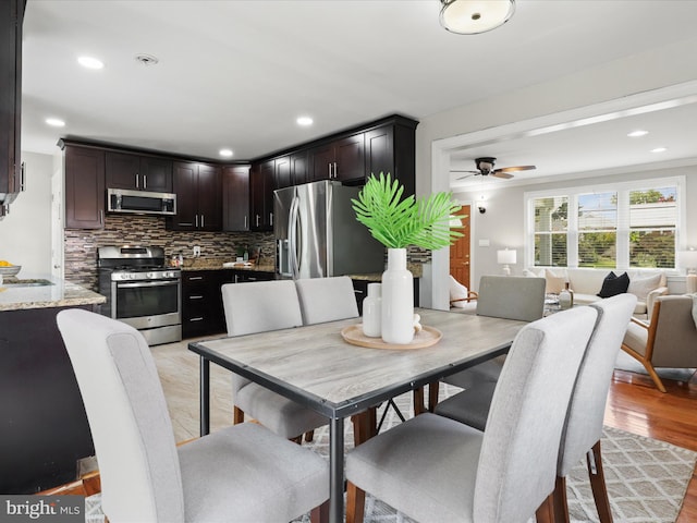 dining room featuring recessed lighting, a ceiling fan, and light wood finished floors