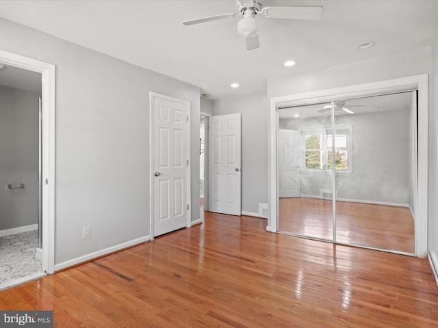 unfurnished bedroom featuring recessed lighting, baseboards, wood-type flooring, and ceiling fan