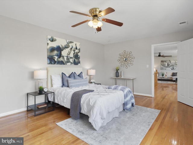 bedroom featuring light wood-type flooring and ceiling fan