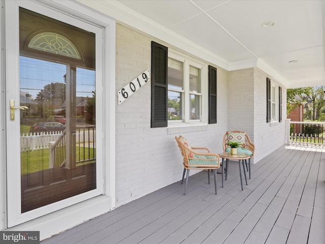 wooden terrace with a porch