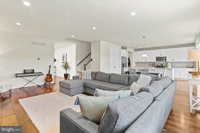 living room with light hardwood / wood-style floors