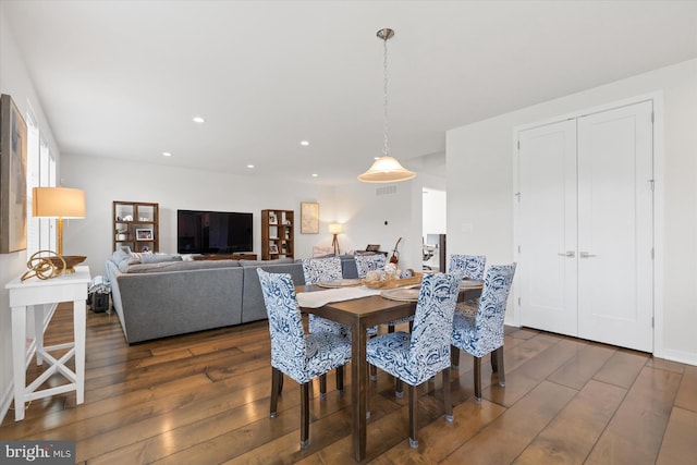 dining area featuring dark hardwood / wood-style floors