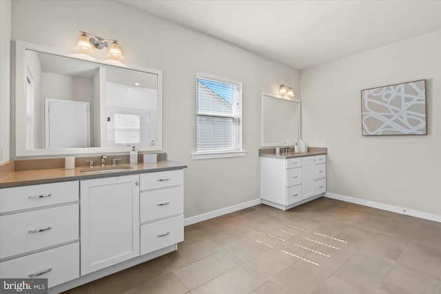 bathroom featuring tile patterned flooring and vanity