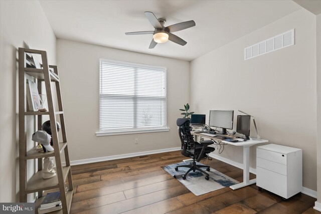 office space featuring ceiling fan and dark wood-type flooring