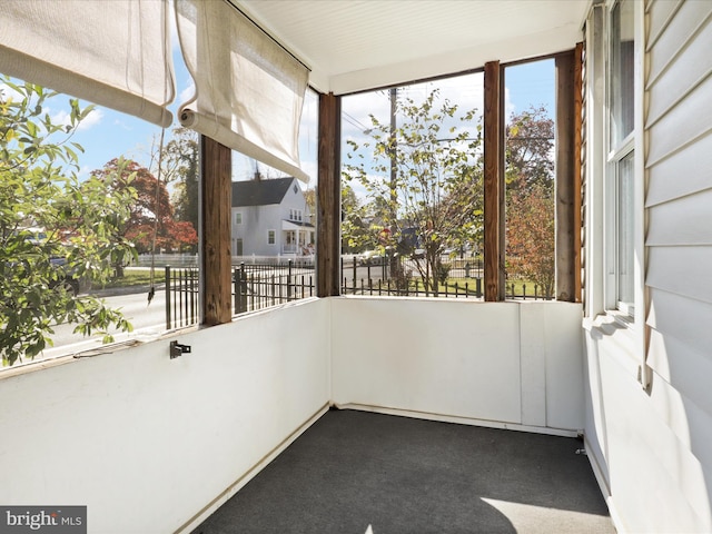 unfurnished sunroom featuring a wealth of natural light