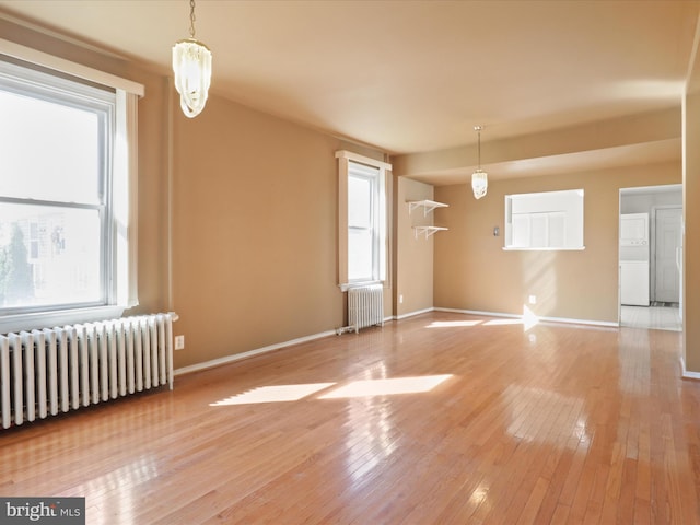 interior space featuring plenty of natural light and radiator