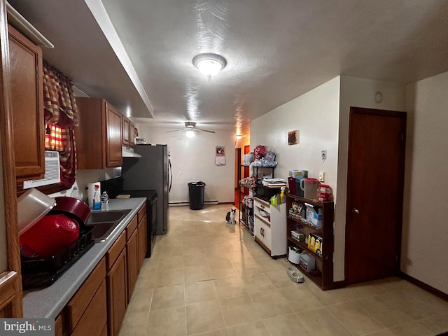 kitchen featuring electric stove, brown cabinets, light countertops, ceiling fan, and under cabinet range hood