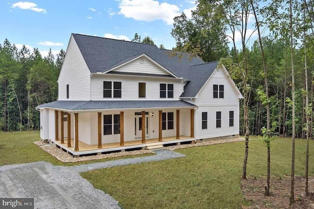 view of front of property with crawl space, covered porch, a shingled roof, and a front yard