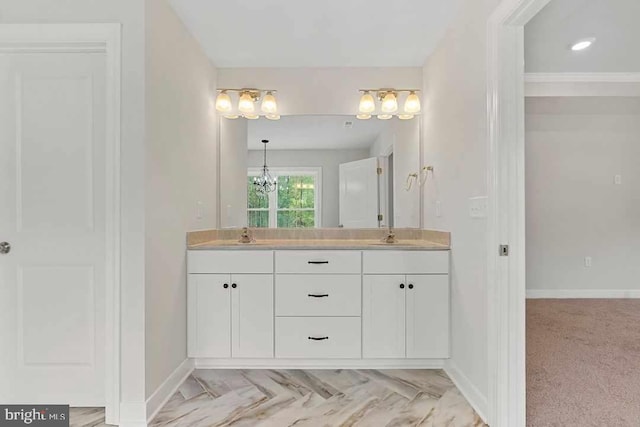 bathroom featuring crown molding and vanity