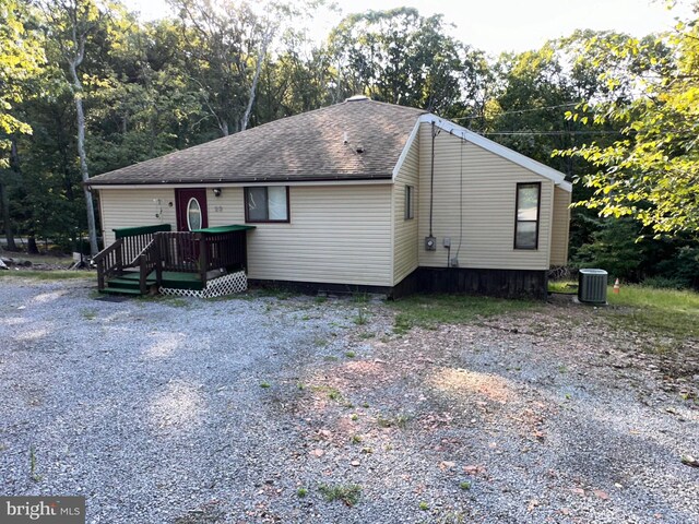 view of front of property featuring a deck and central air condition unit