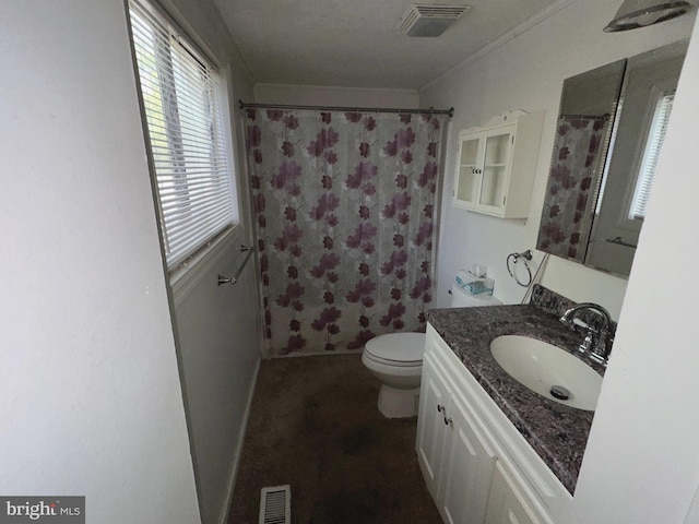 bathroom featuring toilet, walk in shower, and vanity