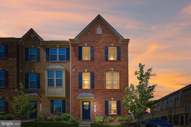 multi unit property featuring brick siding