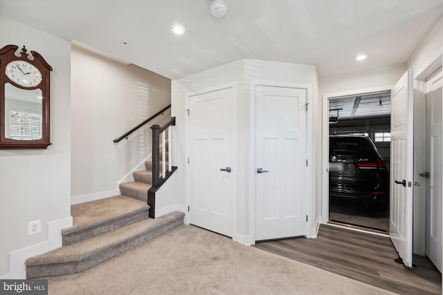 interior space with stairs, baseboards, wood finished floors, and recessed lighting