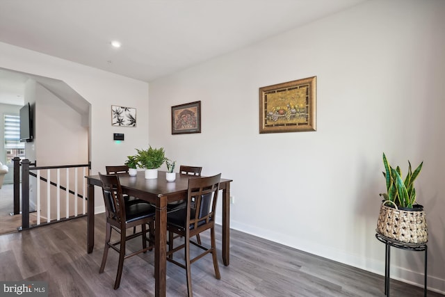 dining area featuring dark wood-style floors, recessed lighting, and baseboards