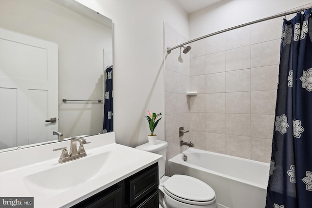 full bathroom featuring shower / bath combo, toilet, and vanity