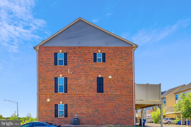 view of property exterior with brick siding