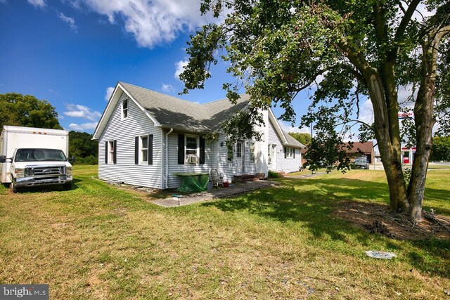 view of home's exterior featuring a lawn and cooling unit