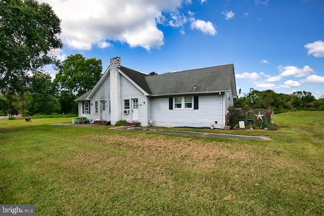 back of property with a yard