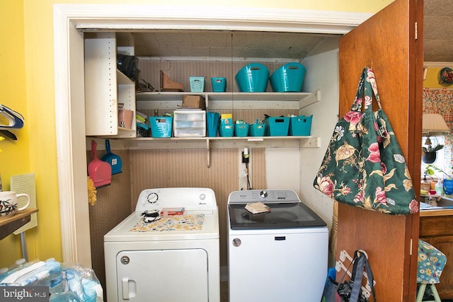 clothes washing area with washer and dryer