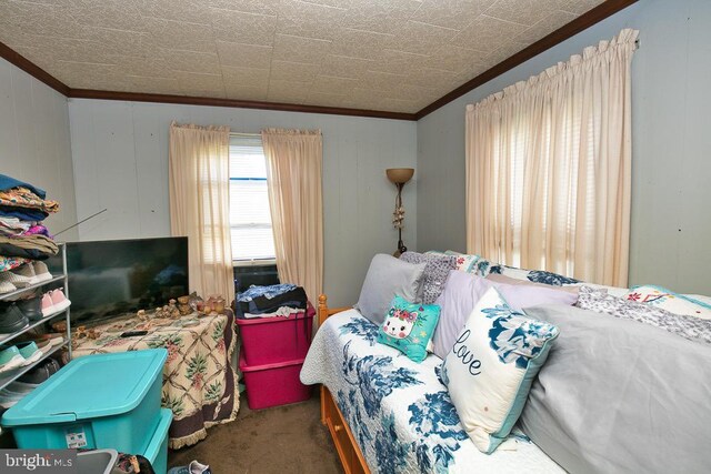 carpeted bedroom featuring ornamental molding