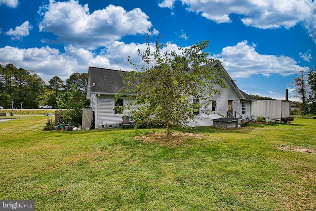 view of property exterior with a yard