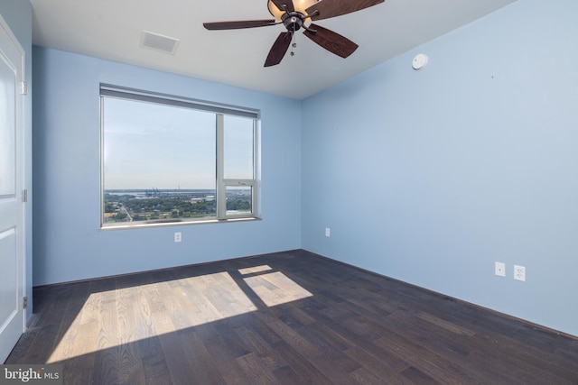 empty room featuring ceiling fan and wood-type flooring