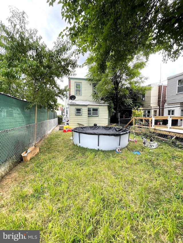 view of yard featuring a pool side deck