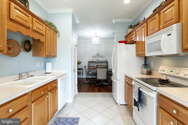 kitchen featuring crown molding, white appliances, light tile patterned floors, and sink