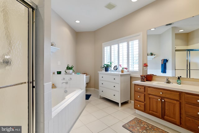 full bathroom featuring tile patterned floors, independent shower and bath, toilet, and vanity