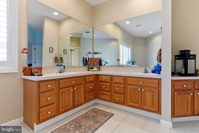 bathroom with tile patterned flooring and vanity