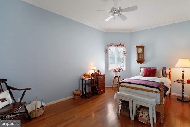 bedroom featuring crown molding, ceiling fan, and hardwood / wood-style floors