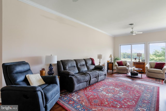 living room featuring ornamental molding, dark hardwood / wood-style flooring, and ceiling fan