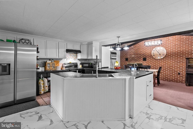 kitchen with light tile patterned flooring, stainless steel fridge, range with electric cooktop, and white cabinets