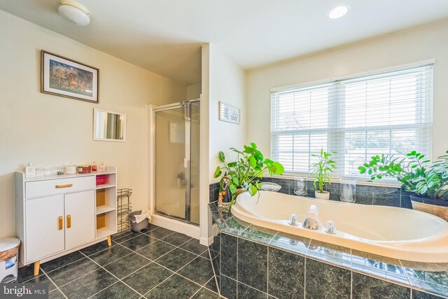 bathroom with tile patterned floors and plus walk in shower