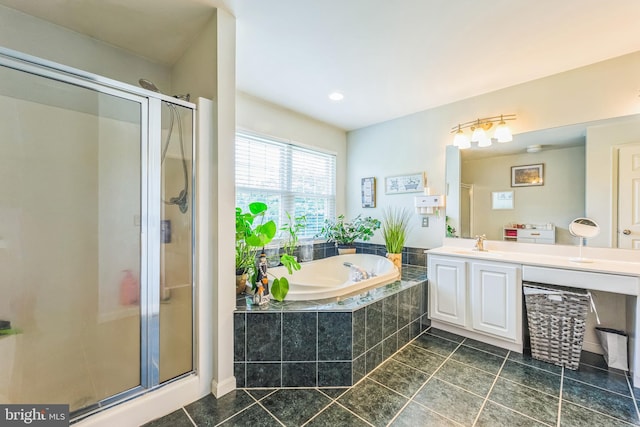 bathroom with vanity, independent shower and bath, and tile patterned flooring