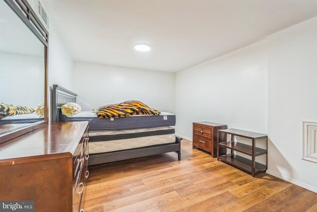 bedroom with light wood-type flooring