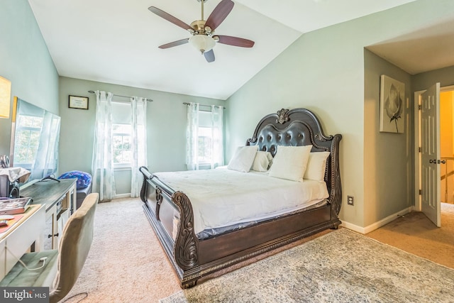 carpeted bedroom with vaulted ceiling and ceiling fan