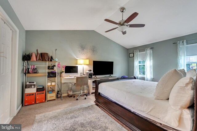 carpeted bedroom featuring vaulted ceiling and ceiling fan