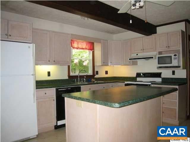 kitchen with sink, white cabinetry, beamed ceiling, white appliances, and ceiling fan