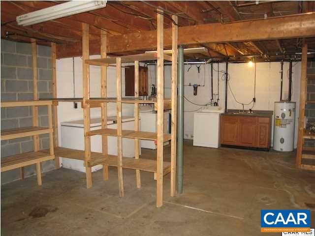 basement with washer / dryer and electric water heater