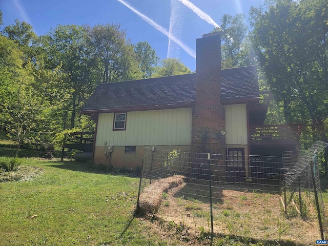 view of property exterior with a yard