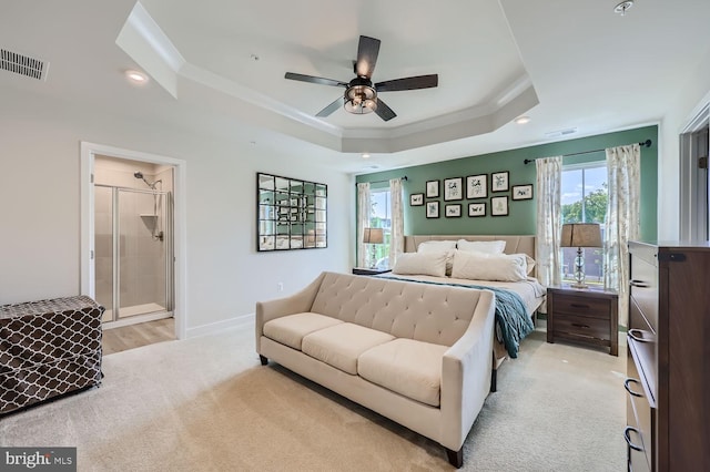 bedroom featuring light carpet, a raised ceiling, visible vents, recessed lighting, and ornamental molding