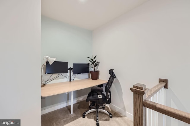 carpeted office with baseboards
