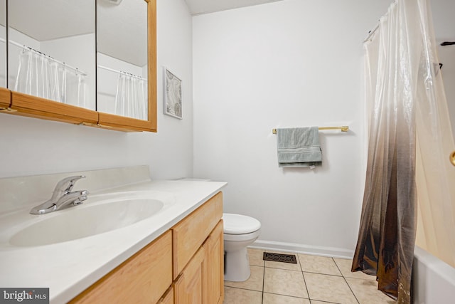 full bathroom featuring vanity, toilet, tile patterned floors, and shower / bath combo