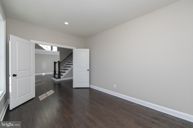 unfurnished bedroom with hardwood / wood-style floors