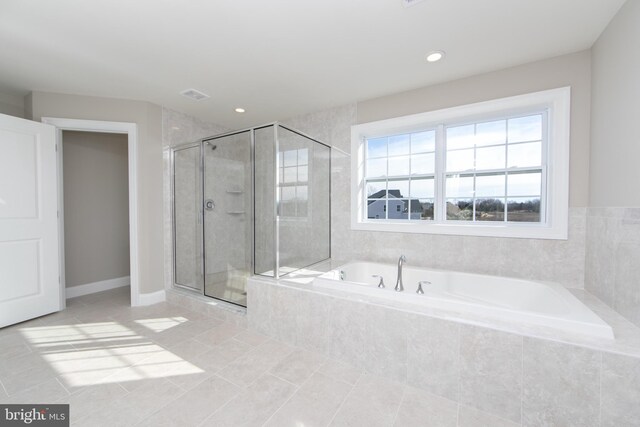 bathroom with shower with separate bathtub and tile patterned flooring