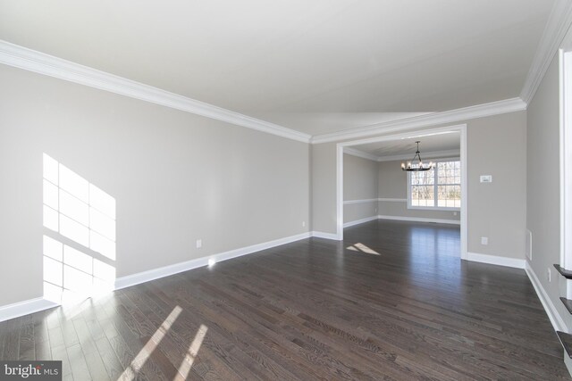 unfurnished living room featuring a notable chandelier, crown molding, and hardwood / wood-style flooring